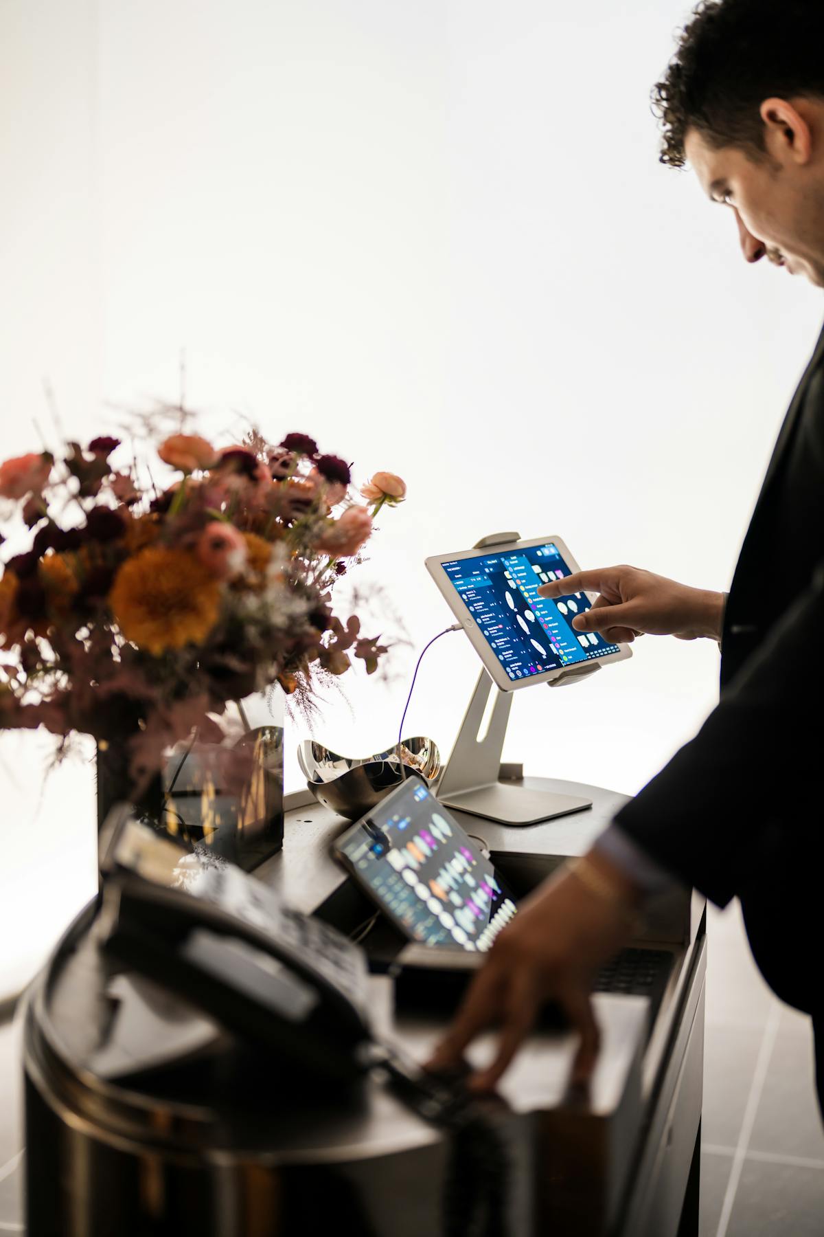 a man standing in front of a computer